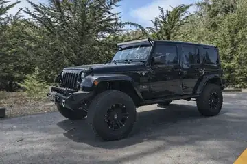 Jeep Wrangler 2016 4x4 rental vehicle photo 3
